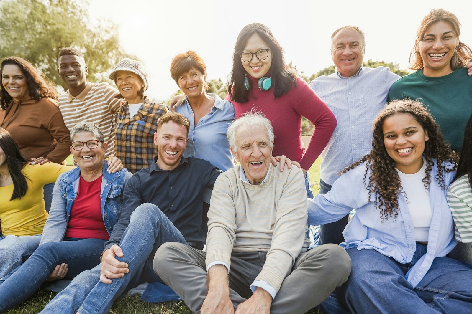 Group of multigenerational people smiling in front of camera